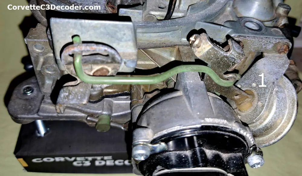 Choke Pull-Off Mechanism in a Quadrajet carburetor Choke pull-off mechanism that partially opens the choke plate during cold starts to prevent an overly rich fuel mixture in a Quadrajet carburetor.