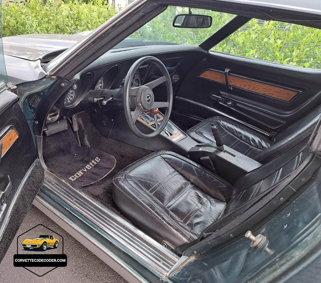 1976 Corvette C3 interior with black leather seats Interior of a 1976 Chevrolet Corvette C3 showing factory black leather seats, dashboard, and classic cockpit layout