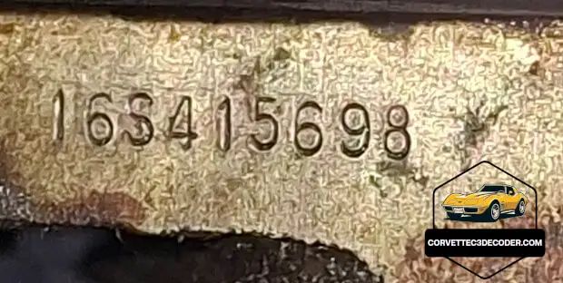 1976 Corvette C3 partial VIN stamping on engine block Close-up of the partial VIN stamping on the engine block of a 1976 Chevrolet Corvette C3, confirming numbers matching originality